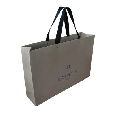 China Recyclable Wholesale Ceremony Luxury Custom Paper Bag Logo Apparel Shopping Bag for sale