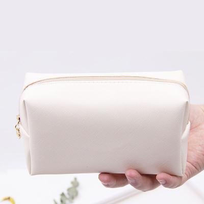 China Simple Logo Travel Bulk Waterproof Girls Waterproof Professional Custom Leather Makeup Bags Foldable PU Cosmetic Bag for sale