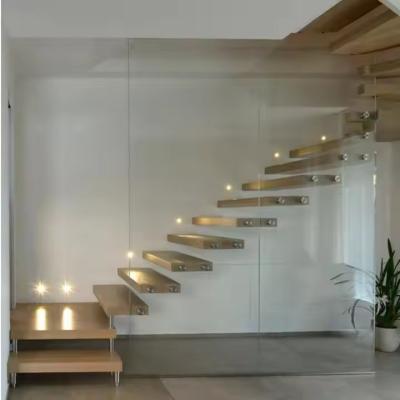 China Laminated Glass Tread Customizable Floating Staircase with Solid Carbon Steel Stringer for sale