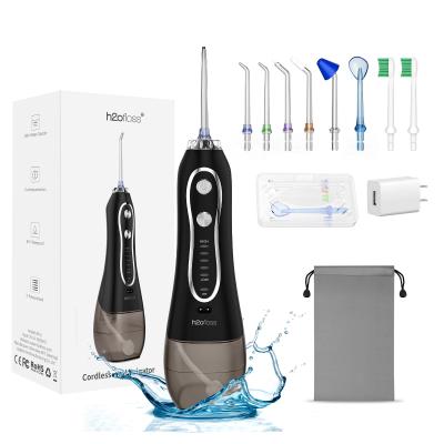 China 300 ml de tanque de agua Flosser de hilo dental chorro de agua con 8 boquillas ODM OEM disponible WaterPik en venta