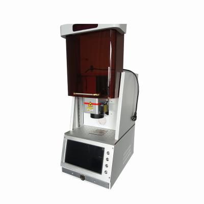 China Air-cooled QK-F20SH Smart high-end fiber laser marking machine for All metal products together with partial plastic products marking for sale