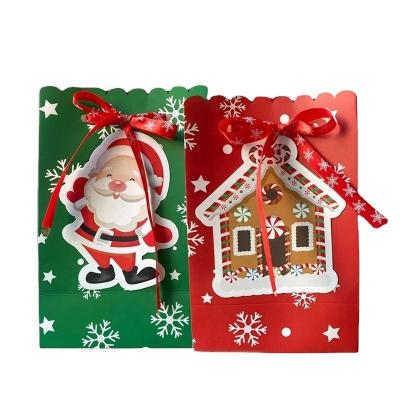 China Recycled Materials Christmas Gift Bag Halloween Candy Envelope Bow Snowflake Hand Gift Bag for sale