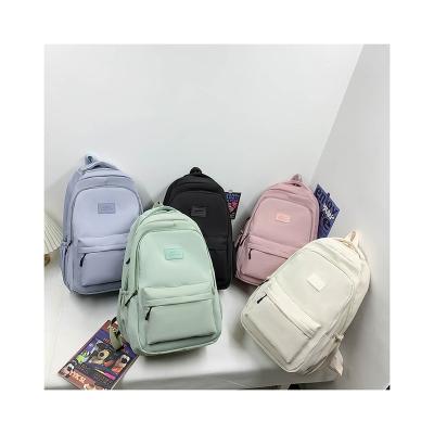 China Waterproof High Quality Korean School Bag Waterproof Large Capacity Leather Logo School Backpack for sale