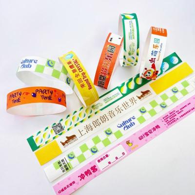 China Waterproof Tyvek Paper Wristbands with Custom Logo Printing Security Barcoding Snap Closure for sale