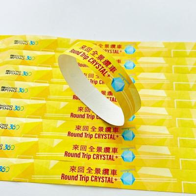 China Custom Logo Waterproof Tyvek Wristbands Full Color Sequential Numbering Snap Closure for sale