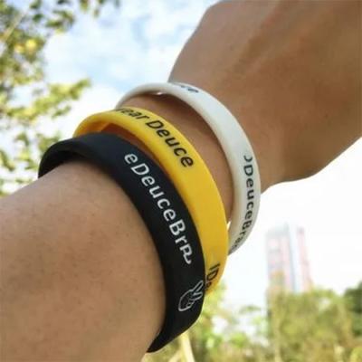 China Custom Logo Printed Silicone Wristbands For Promotion And Advertising Multi color Night Glow Luminous Silicone Bands for sale