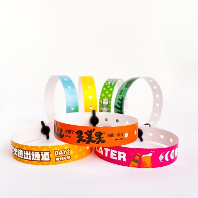 China Disposable Pvc Wristbands Supplier Water Resistant Customizable Logo Text Event Party Bracelet for sale