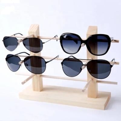 China Wooden Natural Bamboo Wall Mounted Glasses Display Rack Sunglasses Wholesale Display Stand Wood for sale