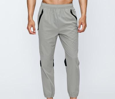 China QUICK DRY Mens Joggers Pants Fitness Men Sportswear Casual Tracksuit Bottoms Gray Gyms Cargo Track Skinny Jogger Pants Sweatpants Pants for sale