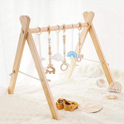 China Toy Foldable Baby Play Gym Educational Frame Activity Gym with Wooden Baby Teether Toys Montessori Baby Play Gym Newborn Gift for sale