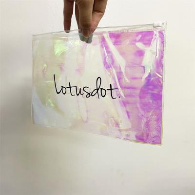 China Hot Sale Recyclable Standing Up Designer Custom Logos Garment Cosmetic PVC Holographic Plastic Bags For Travel Packaging for sale