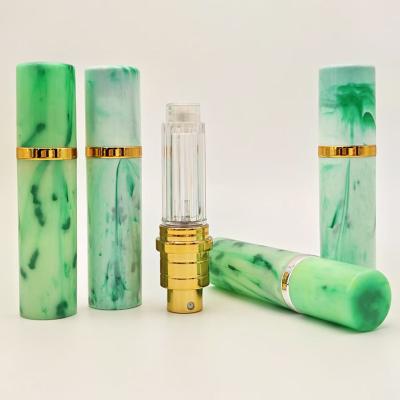 China Customized 5ML Portable Marbling Plastic Perfume Spray Pen With Aluminum Sprayer for sale