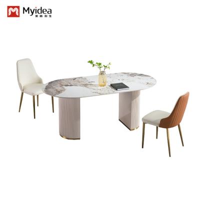 China Tabela de jantar de luxo leve de estilo italiano para uso doméstico, apartamento pequeno, mesa de jantar rectangular simples e moderna, mesa de jantar de pedra de pedra com perna de aço à venda