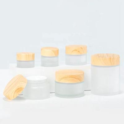 China /15g/30g/50g/100g Cosmetic Clear Frosted Glass Jar For Cosmetic Cream Jars Container With Eco-Friendly Bamboo Lid for sale