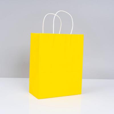 China Disposable High Quality made in China Cheap Kraft Paper Bags Carrying Print packing paper Bag for sale