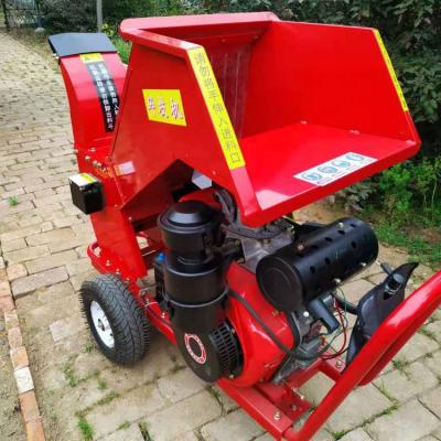China Cutting forestry wood log scrap tractor wood chipper 3 point hitch CE approved small wood tractor bx42 bx52 bx62 bx72 bx92 PTO PTO driven portable chipper for sale