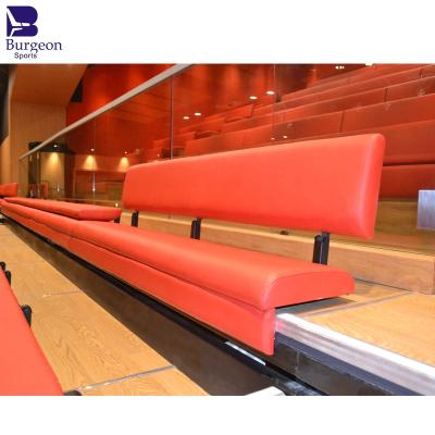 China Multifunctional Hall Wall Attached Retractable Auditorium Seating With Customized Red Fabric Covered Bench Seating for sale