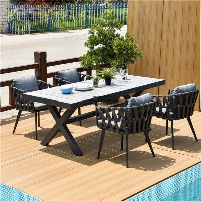 China Modern Outdoor Long Cross Table Aluminum Techwood Table Set 1+4 Waterproof Champagne Color for sale
