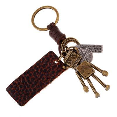 China New Creative Handmade Woven Leather Robot Metal Leather Cute Key Chain Accessories for sale