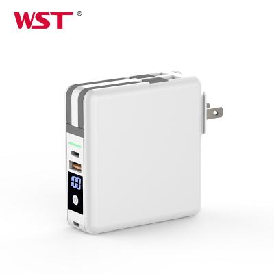 China Multifunctional Portable Power Bank PD QC3.0 Charger 10000mAh 18W Portable Wall Battery Charger with Built-in Wireless Wall Plug Power Bank for sale