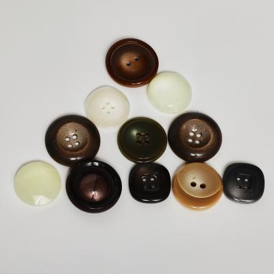 China Other Custom size and logo 4 holes black plastic resin button for windbreaker suit for sale