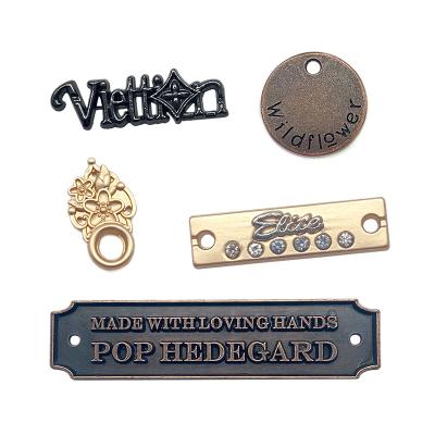 China Silver Design Custom Engravable Metal Logo Tags And Label Viable For Garment for sale