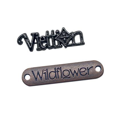 China Designer Viable Gold Custom Logo Sewing On Clothes Labels Garment Patch Manufacturers Metal Tags for sale