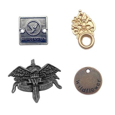 China Gold plating OEM custom logo letter brand clothing label viable metal labels for shawl/garment for sale
