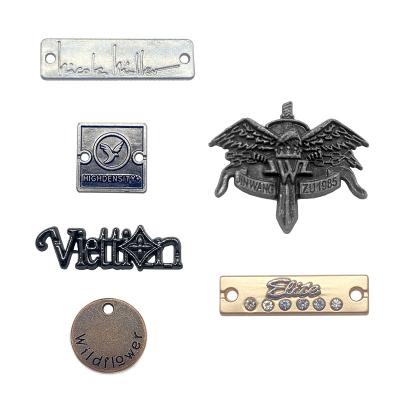 China Sustainable Wholesale Rust Prevention Logo Embossed Metal Labels Plate For Shoes / Shirt for sale