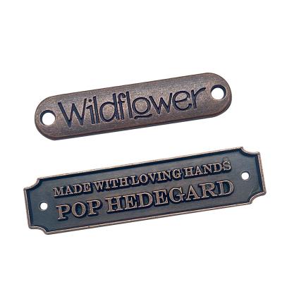China Sustainable Customized Engraved Letter Name Metal Sew Brand Logo Labels For Clothing / Bags for sale