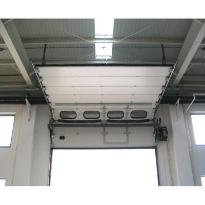 China Windproof Industrial Warehouse Overhead Thermal Insulated Vertical Lifting Sectional Metal Docking Station Garage Roll Up Steel Doors for sale