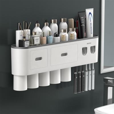 China Minimalist Multifunctional wall mounted automatic toothpaste squeezing device with cup in bathroom tooth brushing cup storage rack for sale