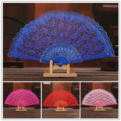 China 2022 China Solid Color Cavity Lace Flower Fan Hand Held Folding Fans Decorative Festival Gift Crafts Art for sale