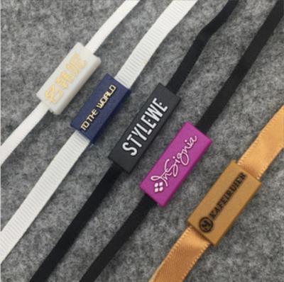 China Custom Logo Hot Stamping Strip Plastic End Viable Rope String Seal Hanging Tag for Clothes Ribbon to Hang Rope for sale