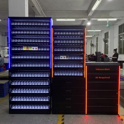China Satom personalizou o suporte do armário de exposição do cigarro de cigarro do metal com a porta para lojas à venda