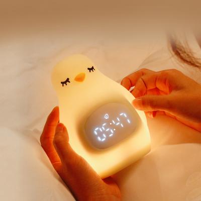 China LED Kids Sleep Trainer Night Light Rechargeable Smart Wake Up Clock Dimmable Soft Silicone Penguin for sale