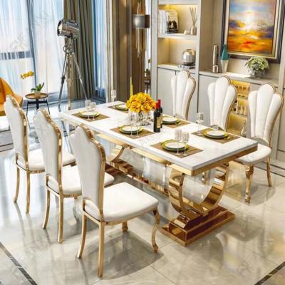China Fanxi factory stainless steel dining table set 8 chairs dining room furniture dining table set for 8 seater gold metal dining tables for sale