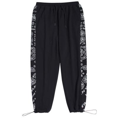 China 2021 New Autumn Retro Men's Casual Pants Anti-wrinkle Mens Loose Cashew Flower Spliced Foot Pants for sale