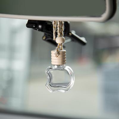 China Apple dá forma ao perfume de vidro do carro engarrafa o ar do carro da aromaterapia do difusor do óleo essencial mais fresco com fio à venda