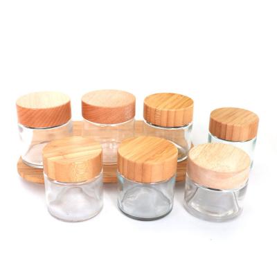 China Diâmetro sem perigo para as crianças 64mm 120ml da tampa dos frascos de vidro transparentes de bambu do concentrado do óleo à venda