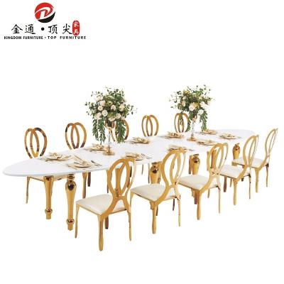 China Luxury Dining Table Traditional Wedding Gold Stainless Steel Table MDF Throne Oval Shaped Furniture for sale