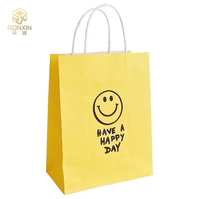 China a altura de 26cm revestiu o presente de papel amarelo ensaca reusável com cara do sorriso à venda