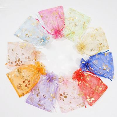 China Sheer Safety Gold Bauhinia Organza Gift Bags Mesh Drawstring Pouch Small Clear Jewelry Drawstring Bag for sale