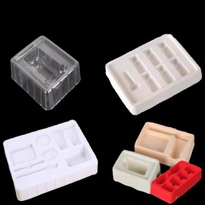 China Customized disposable PP pet PVC PS flocking plastic black/white plastic vacuum tray for cosmetics for sale
