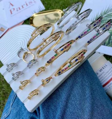 China Decorations Chunky Jewelry 24k Gold Plated Iron Nail Design Zircon Bangle Chunky Colorful Cubic Zirconia Rings For Women for sale