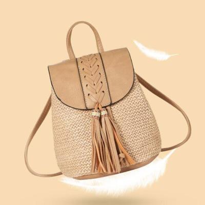 China New Summer PP Straw Spring Double Shoulder Bag Women's Tassel Woven Bucket Waterproof Bag Straddle Women's Bag for sale