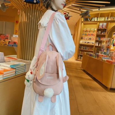 China Wholesale Cute Portable Ladies Tote Saddle Handbag Double Shoulder Women Bunny Shape Colorful Canvas Rabbit Messenger Bag With Pendant for sale