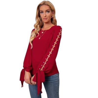 China Hot sale fashion anti-pilling long sleeve crew neck pearl beaded cuff slit sleeve blouse for women for sale