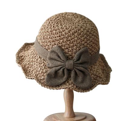 China Character Summer Female Foldable Wide Brim Hand Crochet Large Paper Straw Beach Sun Hat Seaside Vacation Bow Knot For Women Hats for sale