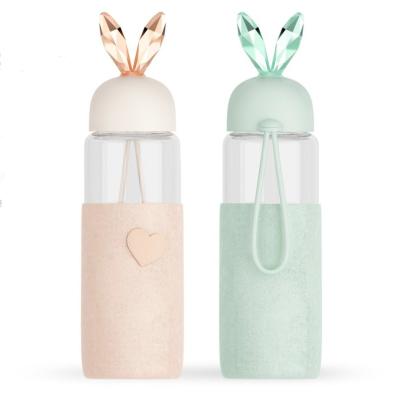 China Cartoon 350ML Rabbit Shape Lids Glass Viable Water Drinking Bottle With Felt Sleeve for sale
